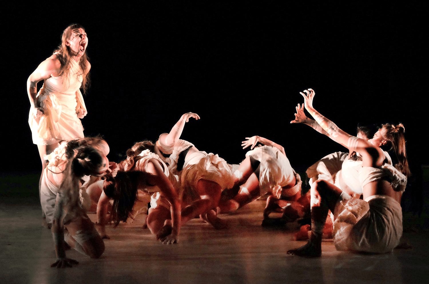 an image of a group of women dressed in white rags on the stage performing a spiritual dance at an african event in berlin